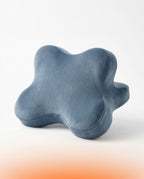 Dusty blue variant of the contoured full body support pillow on white background