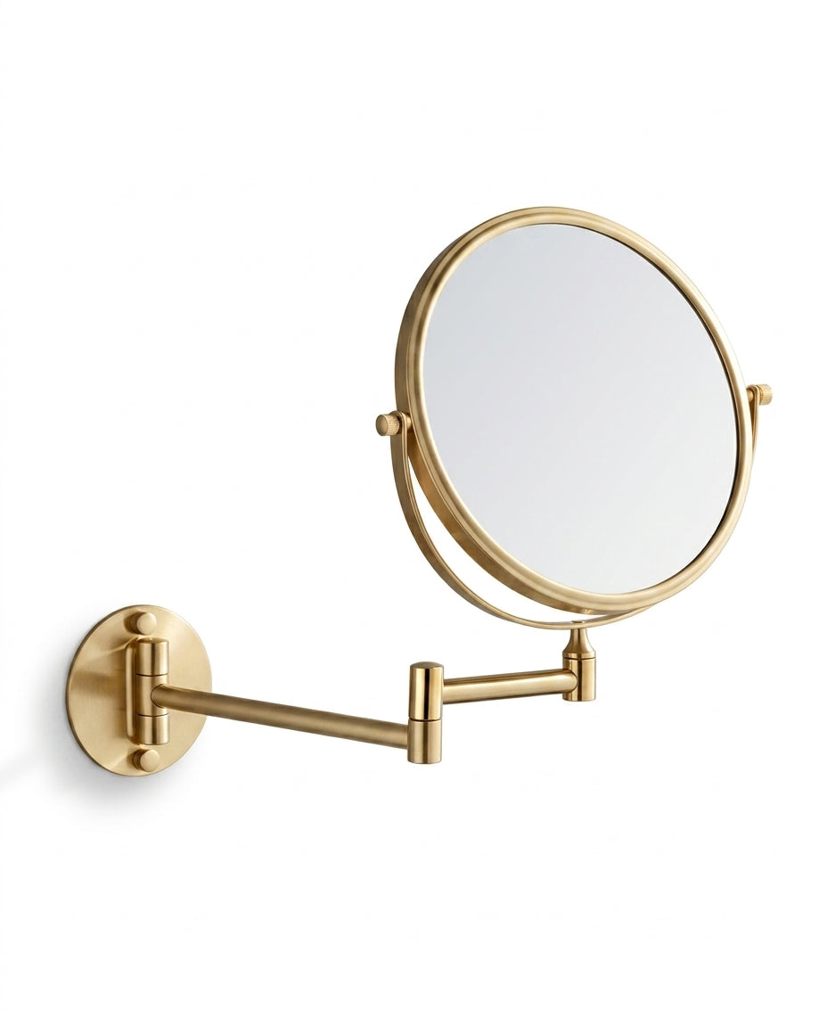 Brushed gold wall-mounted vanity mirror on extendable arm, on white background