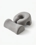 Grey variant of the face-down comfort pillow set, studio shot on white