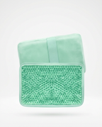 Green variant gel pack with fabric sleeve, studio shot on white