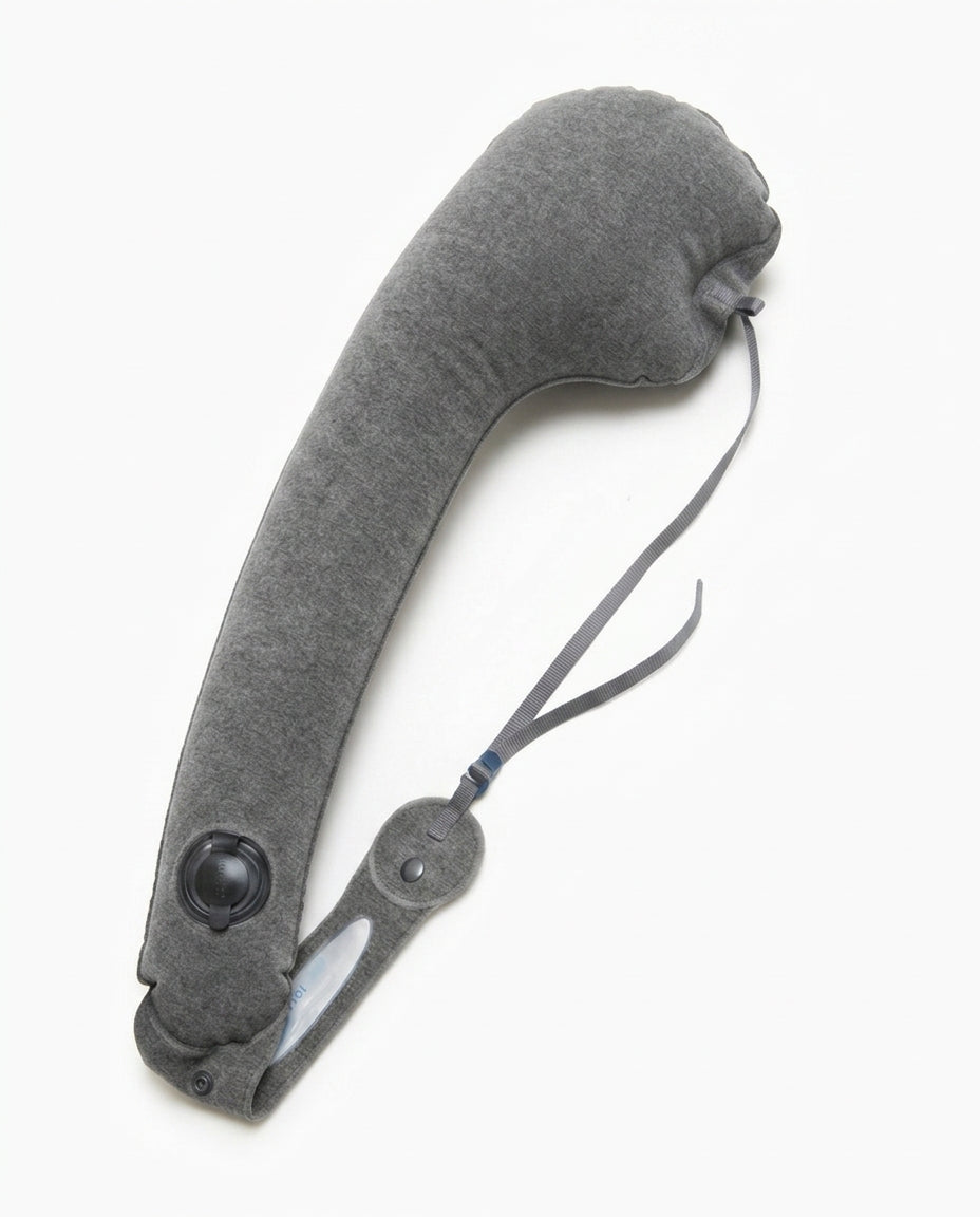 Grey variant of the inflatable travel neck pillow with strap on white