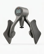 Grey hip trainer for leg and glute exercise, three-quarter studio view
