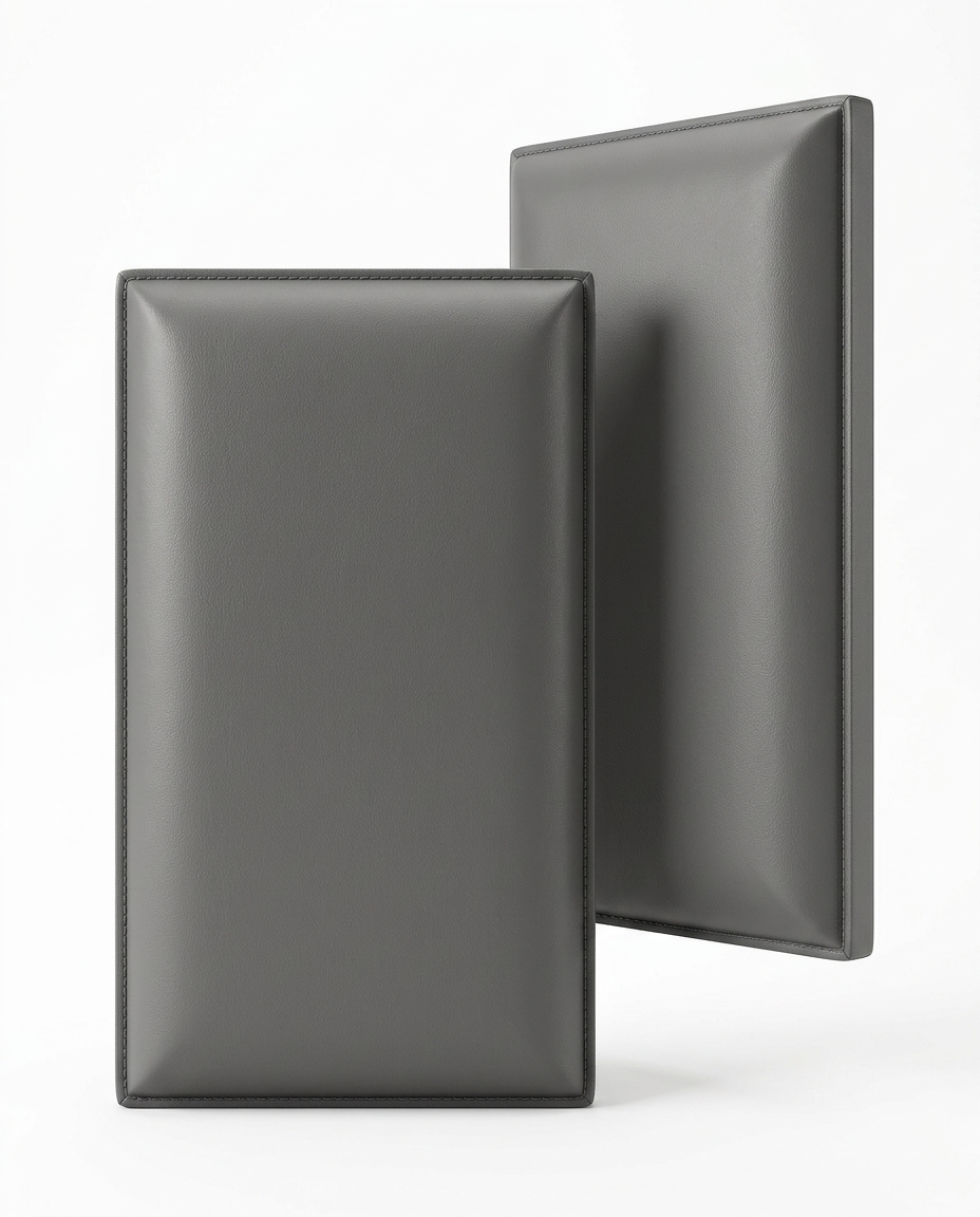 Two grey upholstered wall panels standing on a white background