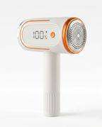 White and orange fabric shaver with LCD display on a white background