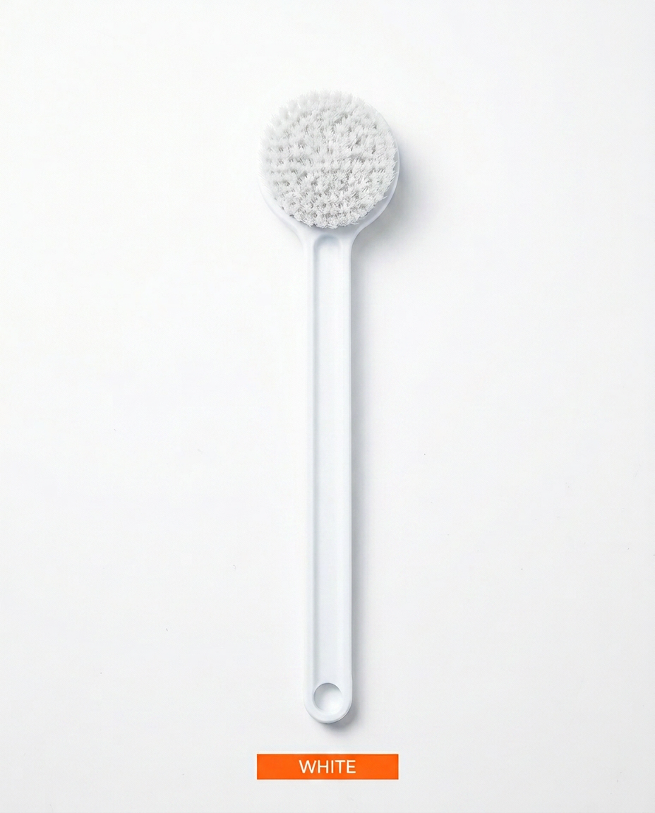 White long-handled soft bristle body brush laid flat, top-down view