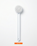 White long-handled soft bristle body brush laid flat, top-down view