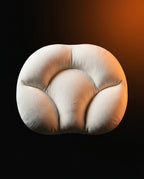 Cream white egg-shaped neck support pillow shown front-on against dark gradient