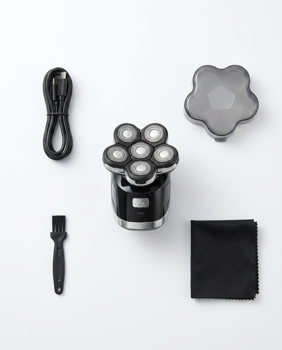 Flat-lay of the 7D shaver kit with cable, cap, cleaning brush and cloth