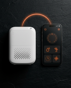 White diffuser paired by Bluetooth with the fragrance control app on a phone