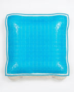 Top-down packshot of the blue gel grid cooling pillow cover on white