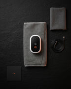 Unboxing flatlay with grey calf wrap, control pod, USB-C cable and pouch