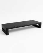 Black monitor riser without USB, angled studio shot on white