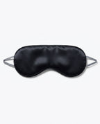 Black silk side of the eye mask with grey strap, packshot on white