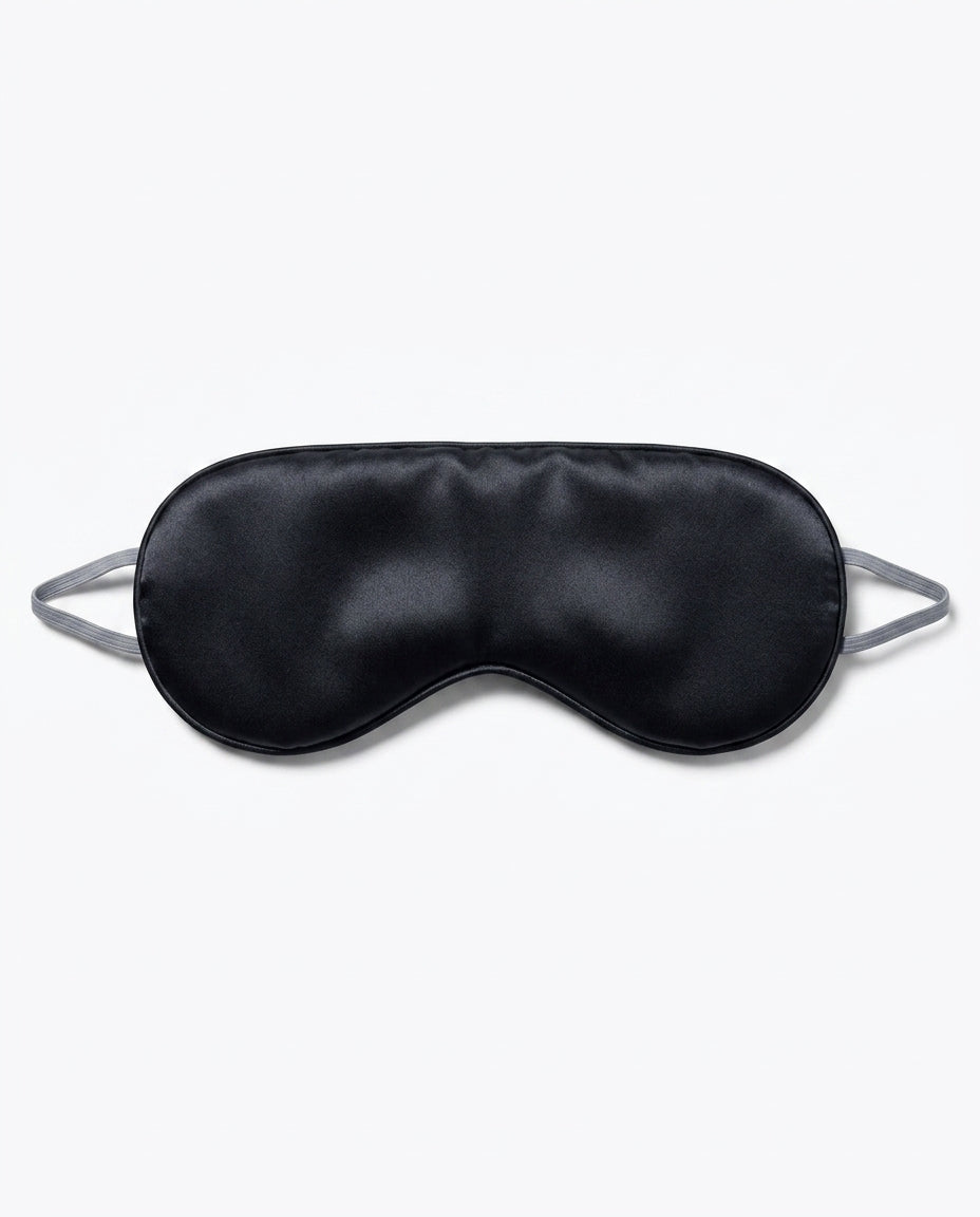 Black silk side of the eye mask with grey strap, packshot on white