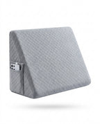 Light grey triangular wedge pillow with side pocket, three-quarter view