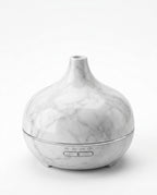 White marble pattern variant of the aromatherapy diffuser on a white background