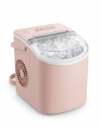 Pink countertop ice maker filled with ice, studio shot on white