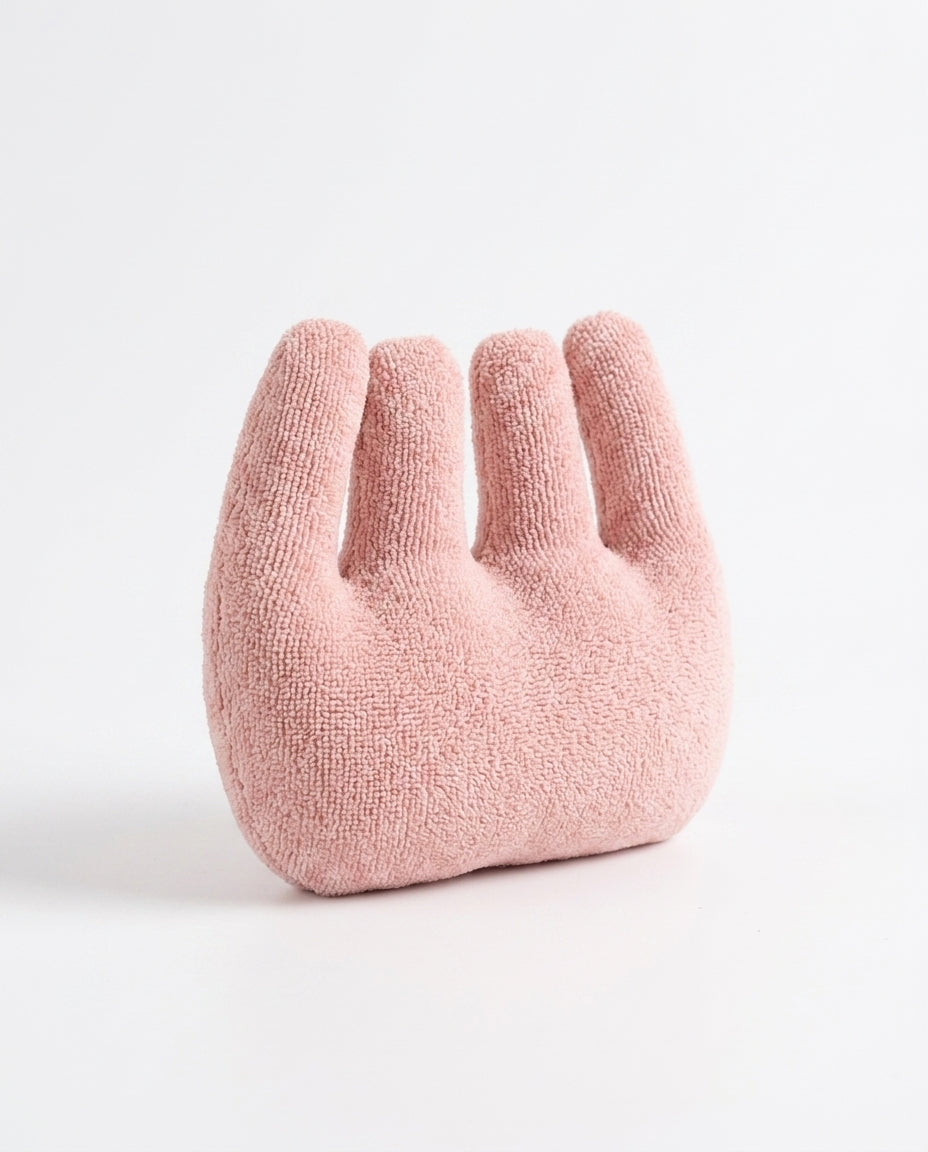 Pink four-finger hand relaxation cushion on a white background