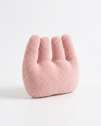 Pink four-finger hand relaxation cushion on a white background