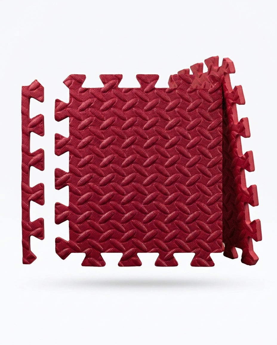 Red EVA foam puzzle exercise mat tiles with interlocking edges on white