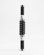 Silver-accent variant of the rolling massage stick, studio on white