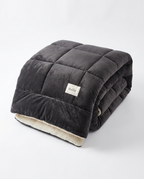 Charcoal dark gray color variant of the plush winter comforter, folded studio shot