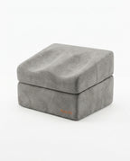 Grey microfiber contoured foot rest cushion, stacked, on white