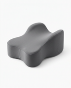 Solid dark grey knee pillow variant, three-quarter angle on white