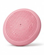 Pink inflatable balance disc with textured nub surface on white background
