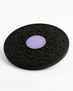 Black wobble balance board with purple center pad on white