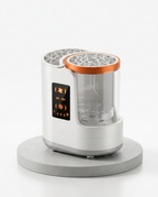 White makeup brush cleaner with empty clear chamber on a grey pedestal, studio shot