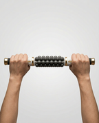 Two hands gripping the massage stick to show its full size