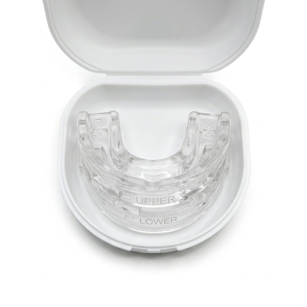 Top-down view of the clear mouth guard seated in its open white case