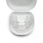 Top-down view of the clear mouth guard seated in its open white case