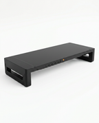 Black monitor riser with built-in USB ports on the front edge