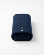 Rolled navy blue heated comfort scarf with power button, studio packshot
