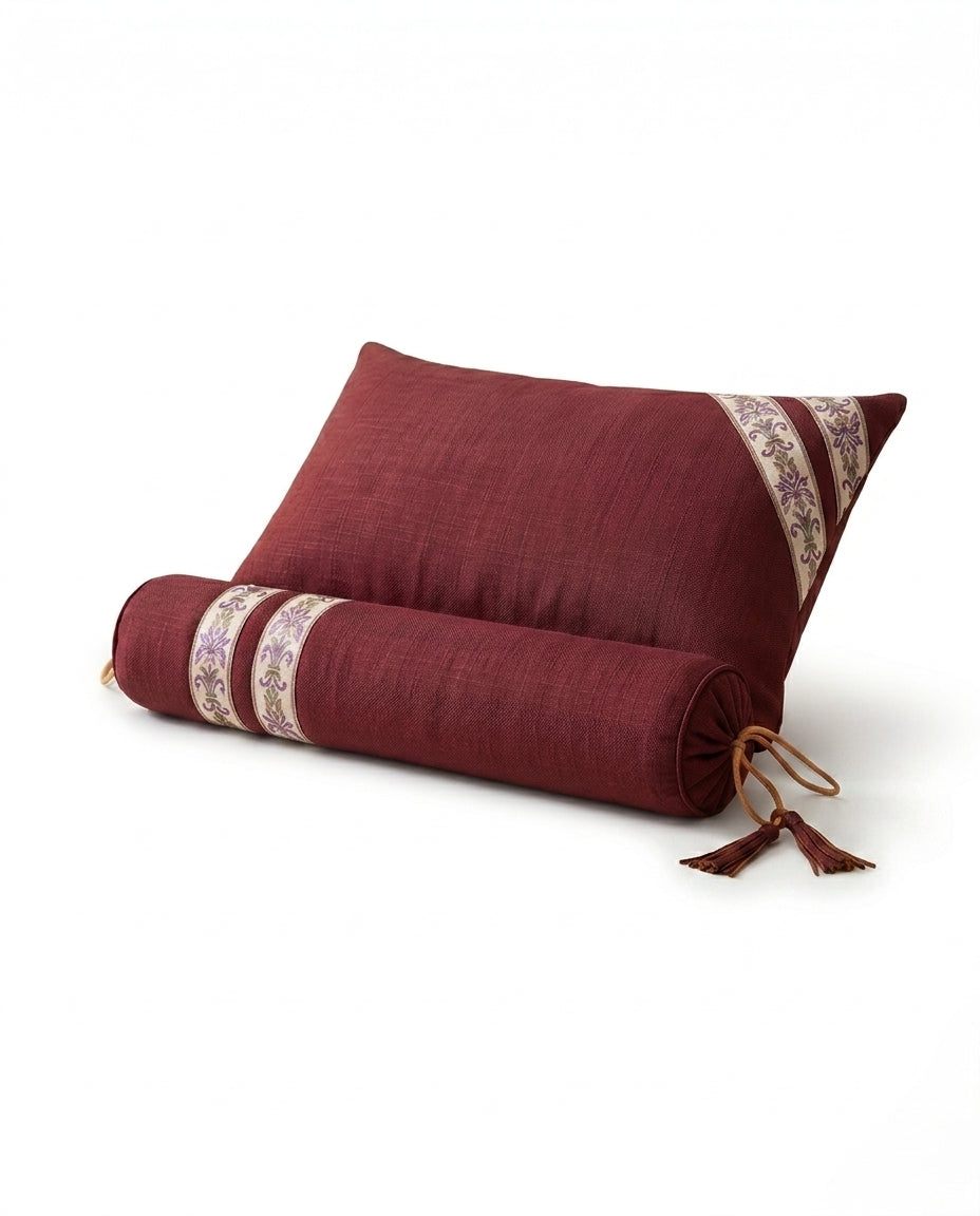 Cabernet red linen support cushion and bolster with ikat trim and tassels on white
