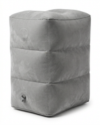 Light grey inflatable travel footrest pillow, studio shot on white background