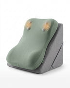 Gray wedge lounger with sage green topper and glowing built-in massage nodes on white
