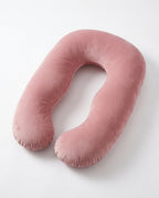 Pink U-shaped full body support pillow on white background