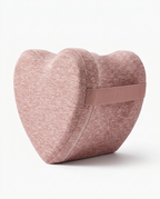 Pink memory foam leg pillow variant with positioning strap on white