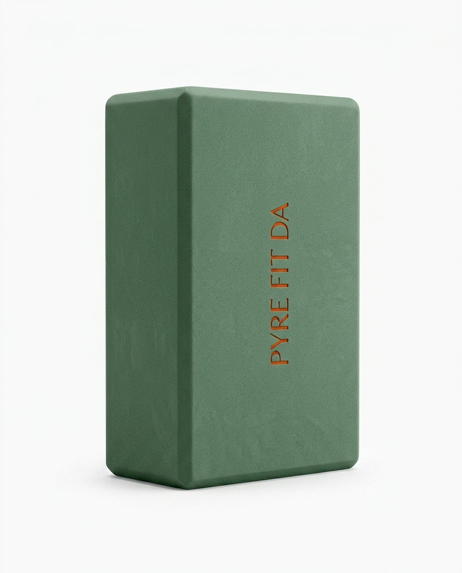 Sage green EVA foam yoga block with embossed logo, studio shot on white