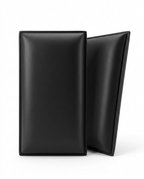 Two black upholstered wall panels standing on a white background