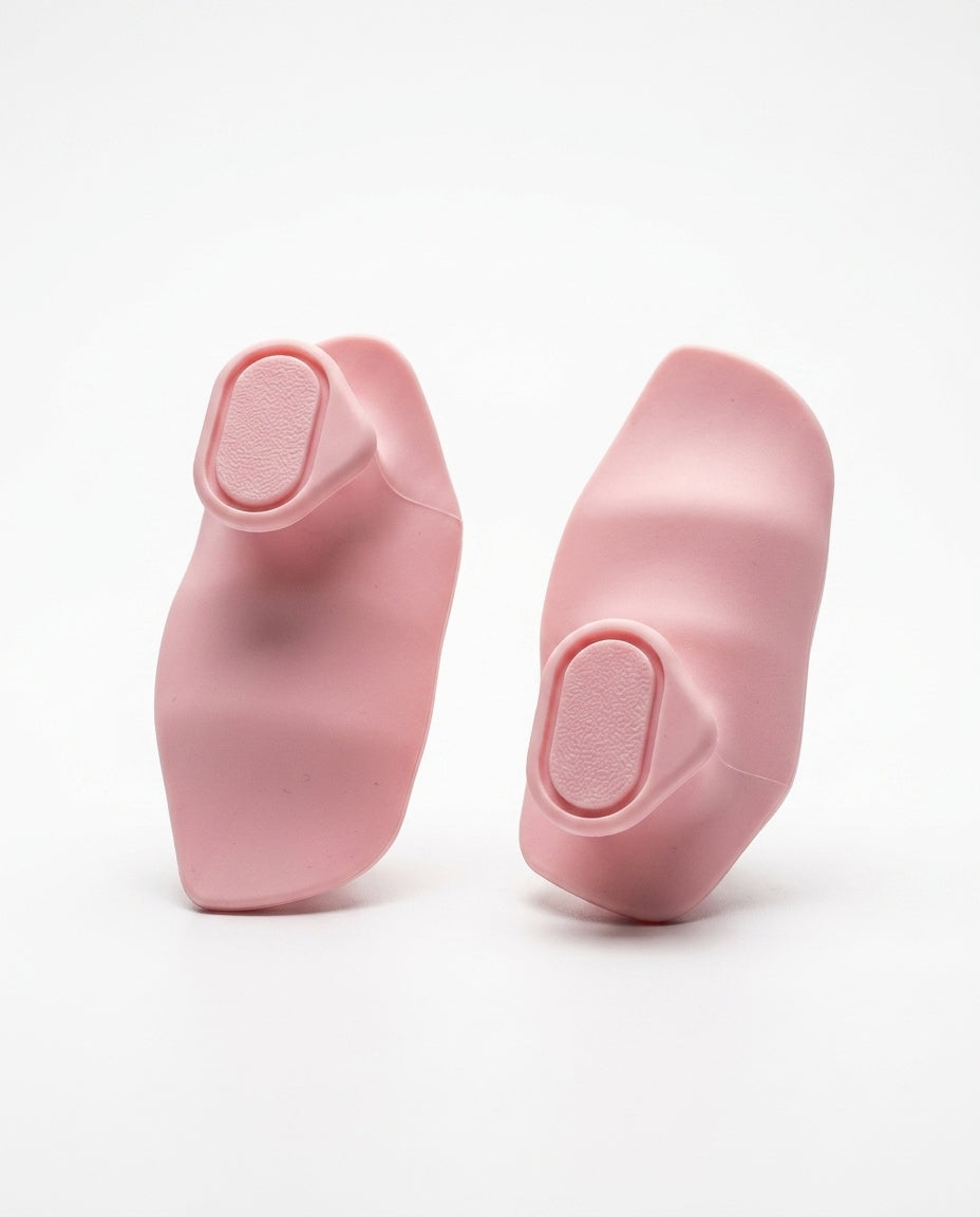Pair of pink silicone weightlifting grip pads on white background