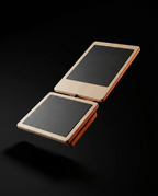 Maple wood ankle balance board floating against a dramatic black background