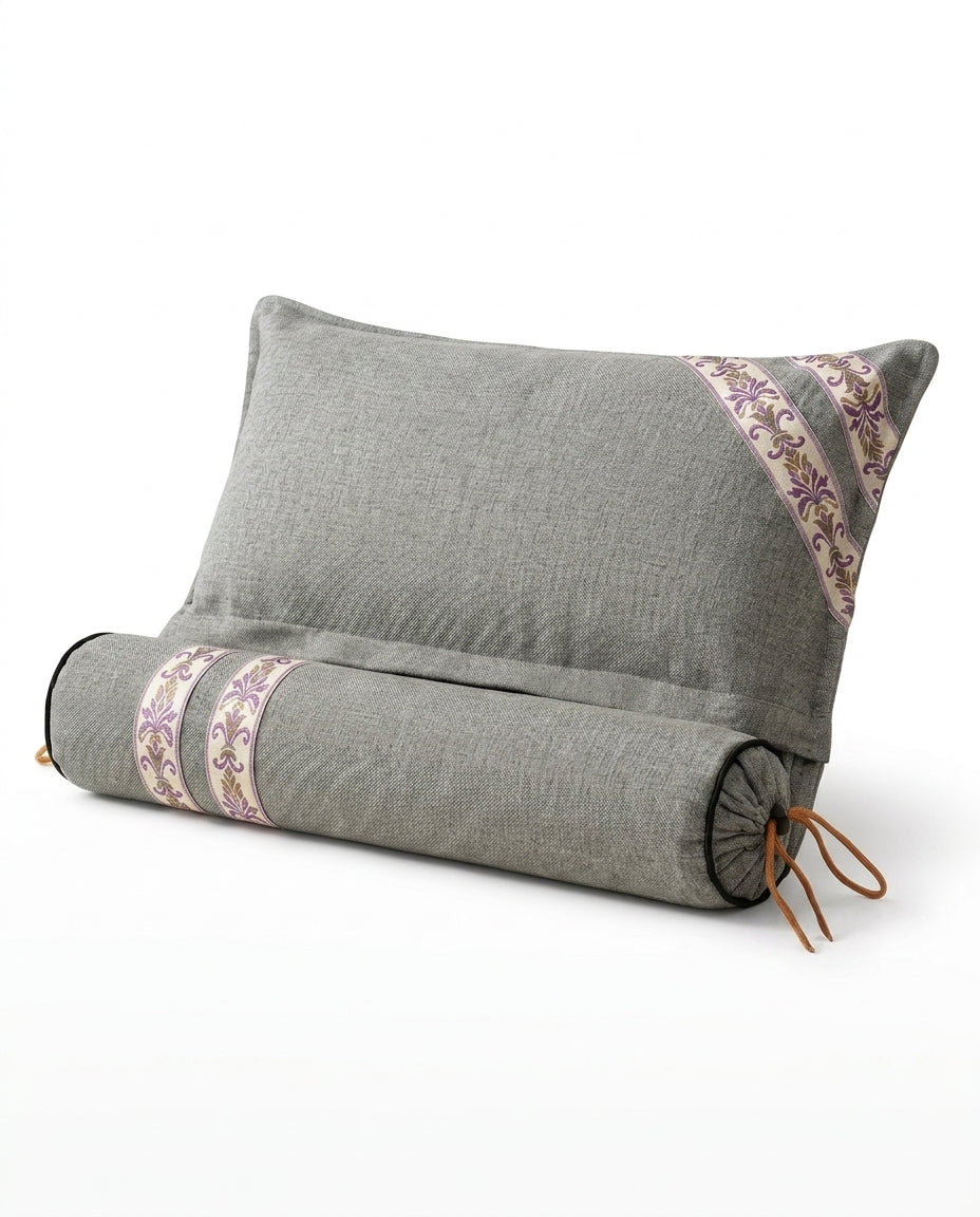 Premium gray linen support cushion and bolster with embroidered trim on white