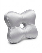 Silver quilted support pillow with central ear hole on white