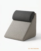 Two-tone gray wedge cushion with dark headrest roll and beige base
