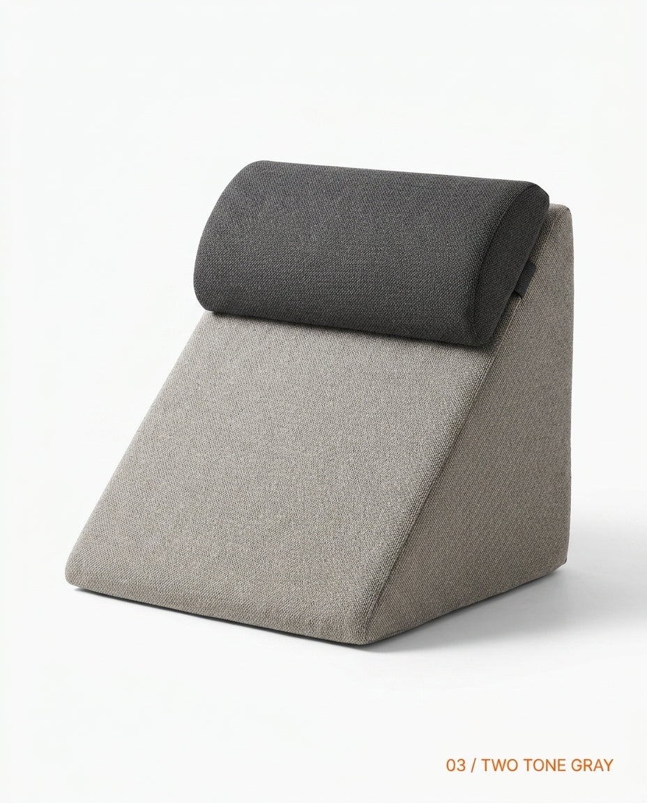 Two-tone gray wedge cushion with dark headrest roll and beige base