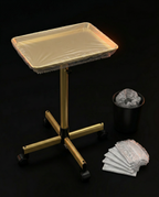 Salon cart with disposable tray cover beside a liner-lined waste bin